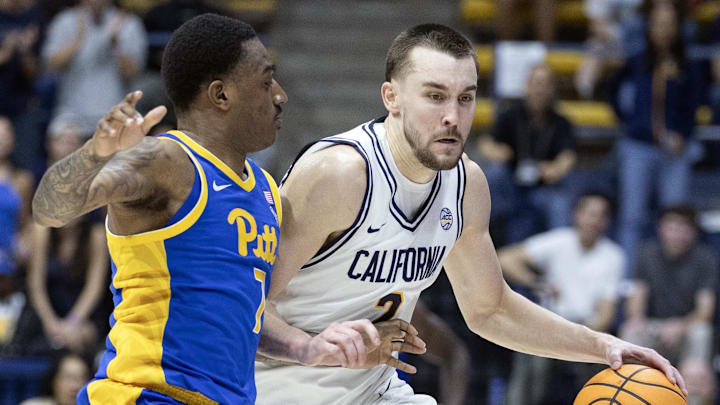 Cal forward John Camden (2) drives on Pitt's Damarco Minor 