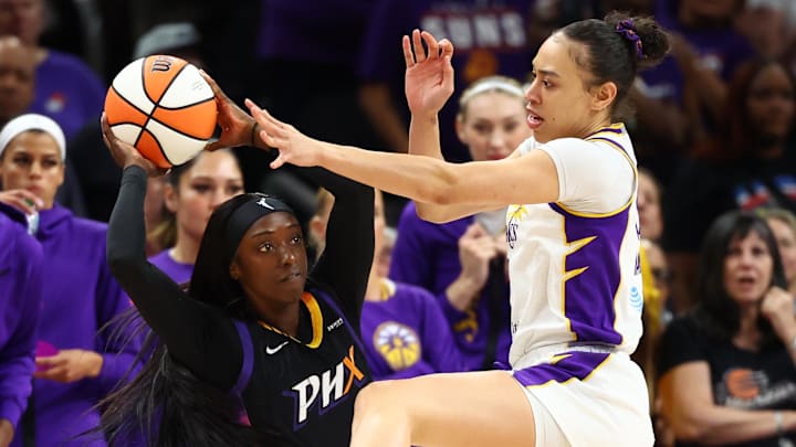Sep 9, 2025; Phoenix, Arizona, USA; Los Angeles Sparks forward Dearica Hamby (5) defends against Phoenix Mercury guard Kahleah Copper (2) during the first half of a WNBA game at PHX Arena. Mandatory Credit: Mark J. Rebilas-Imagn Images