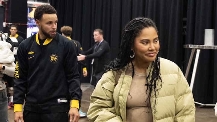 Golden State Warriors guard Stephen Curry (30) with wife Ayesha Curry prior to the game against the Phoenix Suns at Footprint Center.