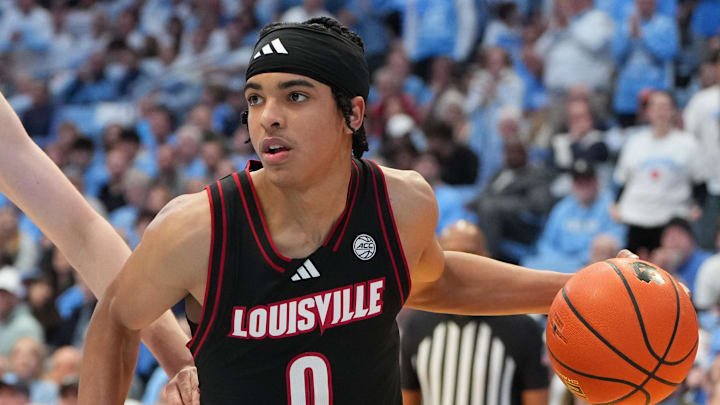 Feb 23, 2026; Chapel Hill, North Carolina, USA; Louisville Cardinals guard Mikel Brown Jr. (0) with the ball in the first half at Dean E. Smith Center. Mandatory Credit: Bob Donnan-Imagn Images