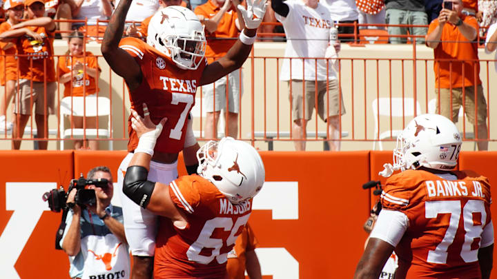 Aug 31, 2024; Austin, Texas, USA; Texas Longhorns wide receiver Isaiah Bond (7) and lineman Jake Majors (65) celebrate after a touchdown against the Colorado State Rams in the first half at Darrell K Royal-Texas Memorial Stadium. Mandatory Credit: Aaron Meullion-Imagn Images