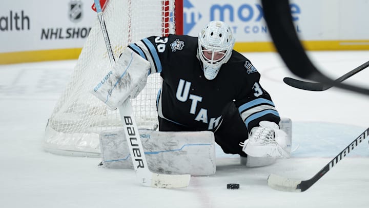 Feb 2, 2025; Salt Lake City, Utah, USA; Utah Hockey Club goaltender Connor Ingram (39) jumps on a loose puck during the first period against the St. Louis Blues at Delta Center. Mandatory Credit: Chris Nicoll-Imagn Images