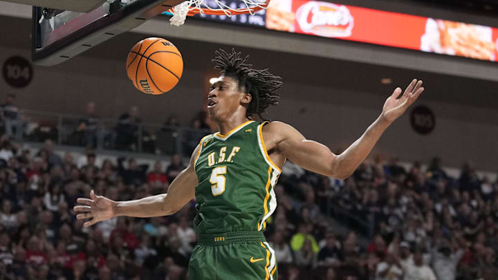 March 10, 2025; Las Vegas, NV, USA; San Francisco Dons guard Tyrone Riley IV (5) dunks the basketball against the Gonzaga Bulldogs during the second half in the semifinal of the West Coast Conference tournament at Orleans Arena. Mandatory Credit: Kyle Terada-Imagn Images