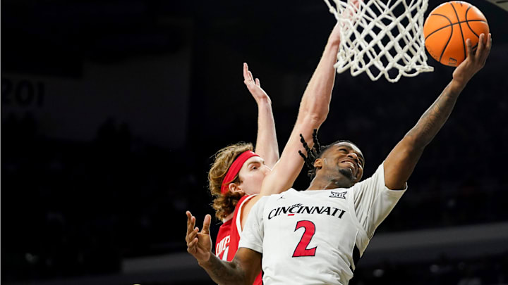 Cincinnati Bearcats guard Jizzle James (2) hits a layup in the second half of a NCAA men’s basketball game between the Cincinnati Bearcats and Utah Utes, Tuesday, Feb. 11, 2025, at Fifth Third Arena in Cincinnati. Bearcats won 85-75.