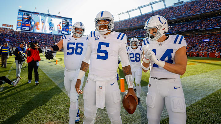 Dec 15, 2024; Denver, Colorado, USA; Indianapolis Colts quarterback Anthony Richardson (5) celebrates with guard Quenton Nelson (56) and wide receiver Alec Pierce (14) after a touchdown in the first quarter against the Denver Broncos at Empower Field at Mile High. Mandatory Credit: Isaiah J. Downing-Imagn Images