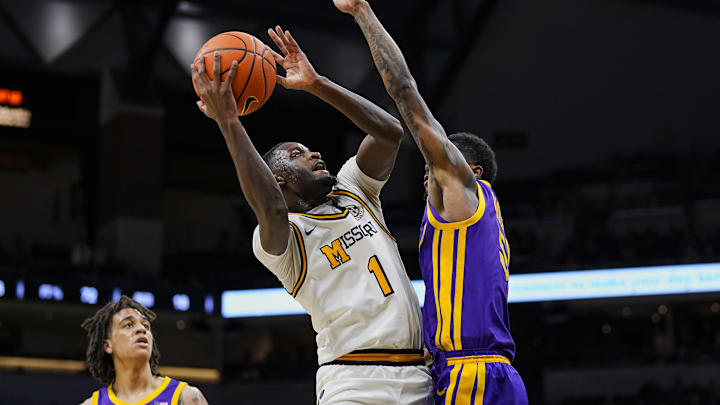 Jan 7, 2025; Columbia, Missouri, USA; Missouri Tigers guard Marques Warrick (1) goes up for a shot against LSU Tigers guard Cam Carter (5) during the first half at Mizzou Arena. Mandatory Credit: Jay Biggerstaff-Imagn Images Jan 7, 2025; Columbia, Missouri, USA; Missouri Tigers guard Marques Warrick (1) goes up for a shot against LSU Tigers guard Cam Carter (5) during the first half at Mizzou Arena. Mandatory Credit: Jay Biggerstaff-Imagn Images