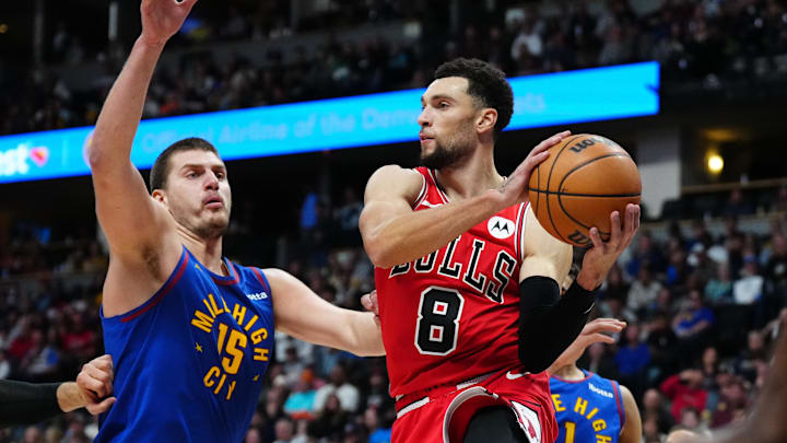 Nov 4, 2023; Denver, Colorado, USA; Denver Nuggets center Nikola Jokic (15) defends on Chicago Bulls guard Zach LaVine (8) in the second quarter at Ball Arena. Mandatory Credit: Ron Chenoy-Imagn Images
