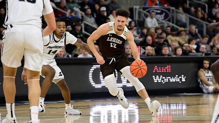 Nov 24, 2023; Providence, Rhode Island, USA; Lehigh Mountain Hawks guard Keith Higgins Jr. (13) drives to the basket during the second half against the Providence Friars at Amica Mutual Pavilion. Mandatory Credit: Eric Canha-Imagn Images