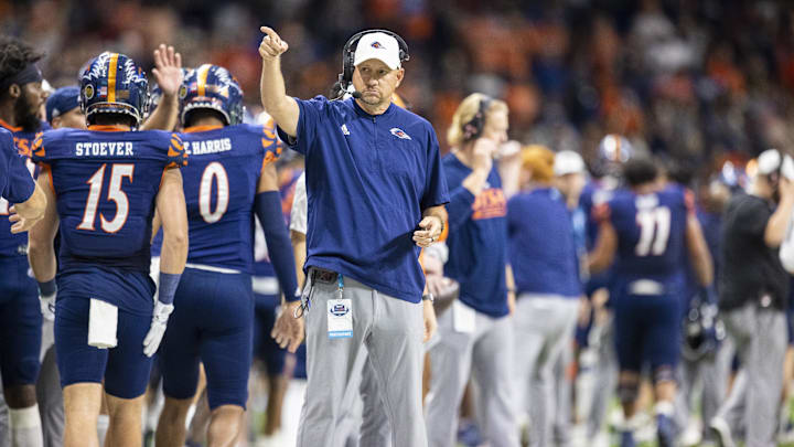 UTSA Roadrunners head coach Jeff Traylor celebrates his team scoring a touchdown against the Western Kentucky Hilltoppers defense during the first quarter of the Conference USA championship game at the Alamodome. UTSA Roadrunners head coach Jeff Traylor celebrates his team scoring a touchdown against the Western Kentucky Hilltoppers defense during the first quarter of the Conference USA championship game at the Alamodome.