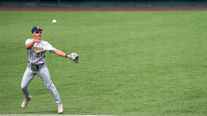 West Virginia infielder JJ Wetherholt (27) throws the ball to first during the game against the Texas Longhorns at UFCU Disch-Falk Field on Saturday, May 20, 2023 in Austin.