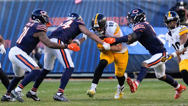 Pittsburgh Steelers tight end Pat Freiermuth (88) runs after the catch as Chicago Bears safety Jaquan Brisker (9) and cornerback Nick McCloud (24) defend during the second half at Soldier Field. 