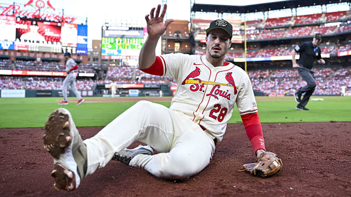 May 18, 2024; St. Louis, Missouri, USA;  St. Louis Cardinals third baseman Nolan Arenado (28) slides and catches a foul ball against the Boston Red Sox during the fifth inning at Busch Stadium. Mandatory Credit: Jeff Curry-Imagn Images