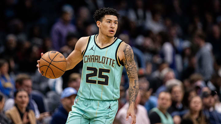 Dec 7, 2024; Charlotte, North Carolina, USA; Charlotte Hornets guard KJ Simpson (25) brings the ball up court against the Cleveland Cavaliers during the first quarter at Spectrum Center. Mandatory Credit: Scott Kinser-Imagn Images