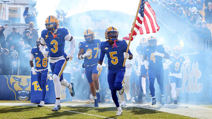 Nov 29, 2025; Pittsburgh, Pennsylvania, USA; Pittsburgh Panthers linebacker Rasheem Biles (3) and wide receiver Raphael Williams Jr. (5) lead the team onto the field to play the Miami Hurricanes at Acrisure Stadium. Mandatory Credit: Charles LeClaire-Imagn Images Nov 29, 2025; Pittsburgh, Pennsylvania, USA; Pittsburgh Panthers linebacker Rasheem Biles (3) and wide receiver Raphael Williams Jr. (5) lead the team onto the field to play the Miami Hurricanes at Acrisure Stadium. Mandatory Credit: Charles LeClaire-Imagn Images