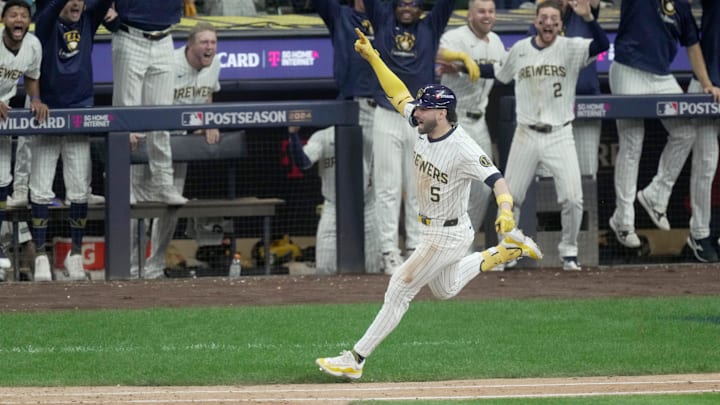 Milwaukee Brewers outfielder Garrett Mitchell (5) hits a two-run home run during the eighth inning of Game 2 of the NL Wild Card Series against the New York Mets on Wednesday, October 2, 2024, at American Family Field in Milwaukee, Wisconsin. Milwaukee Brewers outfielder Garrett Mitchell (5) hits a two-run home run during the eighth inning of Game 2 of the NL Wild Card Series against the New York Mets on Wednesday, October 2, 2024, at American Family Field in Milwaukee, Wisconsin.