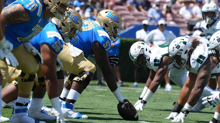 Aug 28, 2021; Pasadena, California, USA; A general overall view of the line of scrimmage as UCLA Bruins offensive lineman Jon Gaines II (57) snaps the ball against the Hawaii Rainbow Warriors at Rose Bowl. Mandatory Credit: Kirby Lee-Imagn Images Aug 28, 2021; Pasadena, California, USA; A general overall view of the line of scrimmage as UCLA Bruins offensive lineman Jon Gaines II (57) snaps the ball against the Hawaii Rainbow Warriors at Rose Bowl. Mandatory Credit: Kirby Lee-Imagn Images