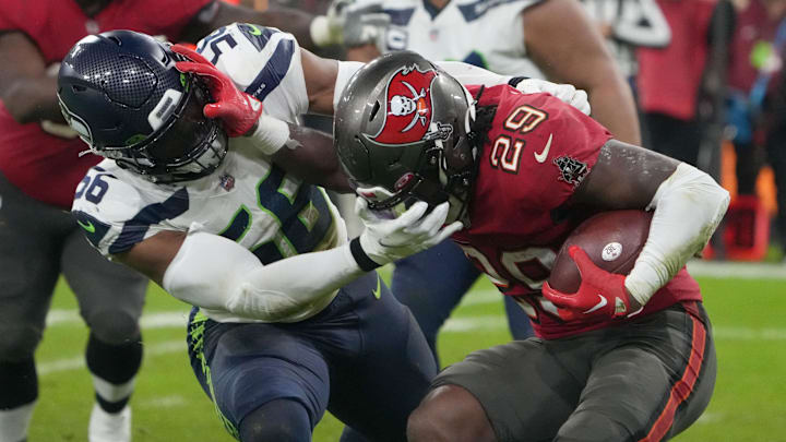Seattle Seahawks linebacker Jordyn Brooks tackles Tampa Bay Buccaneers running back Rachaad White.