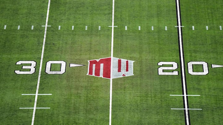 The Mountain West conference logo on the field at Allegiant Stadium. The Mountain West conference logo on the field at Allegiant Stadium.