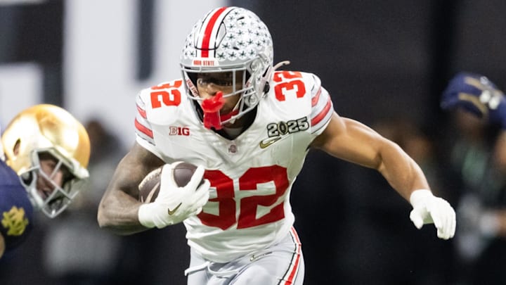 Jan 20, 2025; Atlanta, GA, USA; Ohio State Buckeyes running back TreVeyon Henderson (32) against the Notre Dame Fighting Irish during the CFP National Championship college football game at Mercedes-Benz Stadium. 