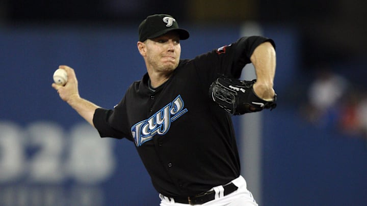 August 9, 2009; Toronto, ON, Canada; Toronto Blue Jays starting pitcher Roy Halladay (32) delivers a pitch against the Baltimore Orioles at the Rogers Centre in Toronto, ON. Mandatory Credit: Tom Szczerbowski-Imagn Images