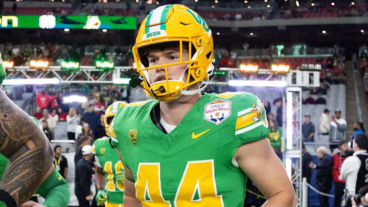 Jan 1, 2024; Glendale, AZ, USA; Oregon Ducks tight end Zach Grace (44) against the Liberty Flames during the 2024 Fiesta Bowl at State Farm Stadium. Mandatory Credit: Mark J. Rebilas-Imagn Images