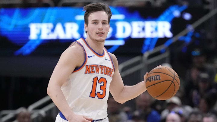 Mar 28, 2025; Milwaukee, Wisconsin, USA; New York Knicks guard Tyler Kolek (13) brings the ball up the court against the Milwaukee Bucks in the second half at Fiserv Forum. Mandatory Credit: Michael McLoone-Imagn Images