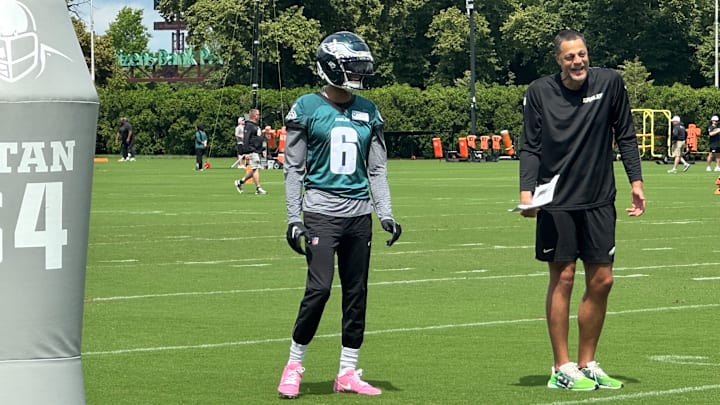 Eagles WR DeVonta Smith and receiver coach Aaron Moorehead share a laugh during Eagles minicamp on June 10, 2025.