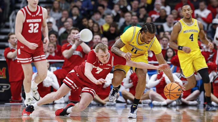 Mar 14, 2026; Chicago, IL, USA; Wisconsin Badgers guard Andrew Rohde (7) battles for the ball with Michigan Wolverines guard Roddy Gayle Jr. (11) during the first half at United Center. Mandatory Credit: Kamil Krzaczynski-Imagn Images Mar 14, 2026; Chicago, IL, USA; Wisconsin Badgers guard Andrew Rohde (7) battles for the ball with Michigan Wolverines guard Roddy Gayle Jr. (11) during the first half at United Center. Mandatory Credit: Kamil Krzaczynski-Imagn Images
