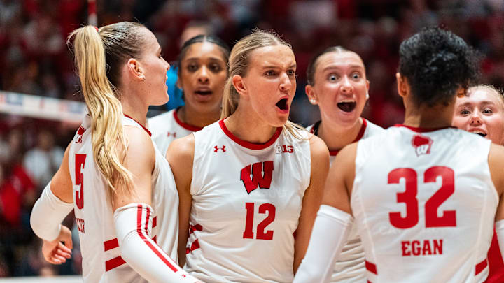 Natalie Wardlow celebrates with her teammates after a point. The Lincoln Southeast graduate recorded four aces for the Badgers against Nebraska. 