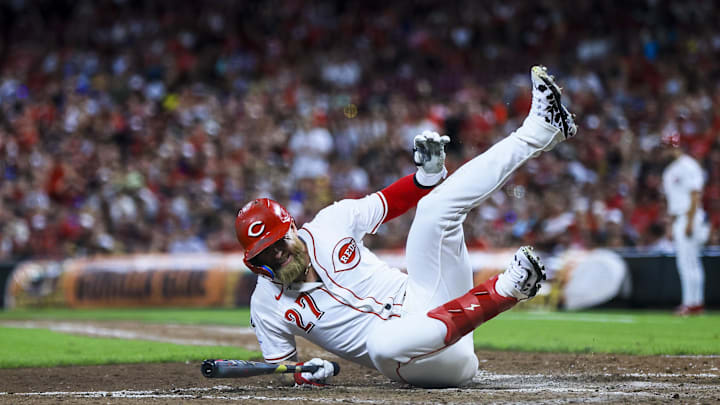 Aug 16, 2025; Cincinnati, Ohio, USA; Cincinnati Reds outfielder Jake Fraley (27) falls after a play in the ninth inning against the Milwaukee Brewers at Great American Ball Park. Mandatory Credit: Katie Stratman-Imagn Images Aug 16, 2025; Cincinnati, Ohio, USA; Cincinnati Reds outfielder Jake Fraley (27) falls after a play in the ninth inning against the Milwaukee Brewers at Great American Ball Park. Mandatory Credit: Katie Stratman-Imagn Images