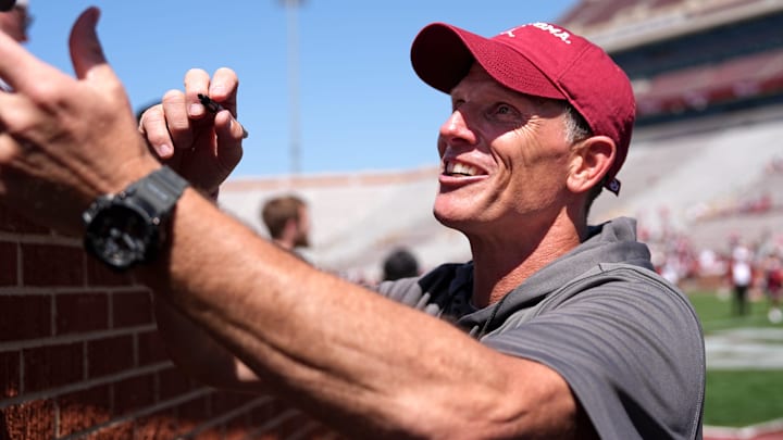 Oklahoma coach Brent Venables interacts with fans at the Sooners' Crimson Combine.