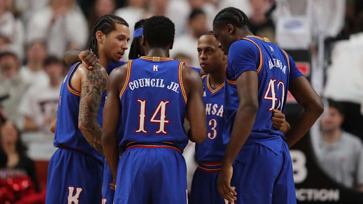 Feb 2, 2026; Lubbock, Texas, USA;  Members of the Kansas Jayhawks during a time out in the second half of the game aginast the Texas Tech Red Raiders at United Supermarkets Arena. Mandatory Credit: Michael C. Johnson-Imagn Images
