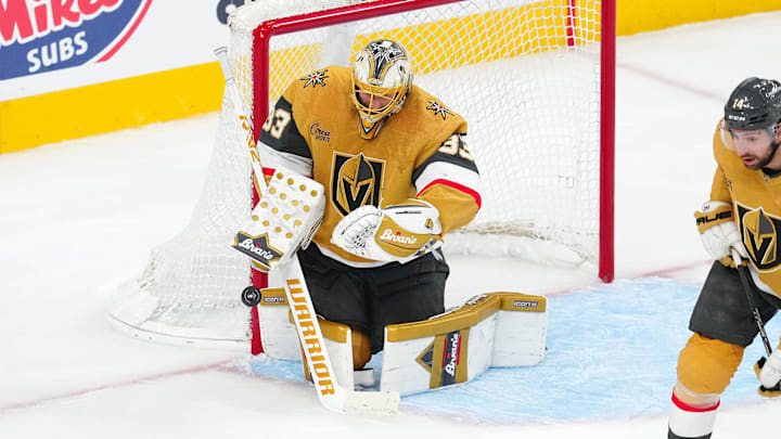 May 6, 2025; Las Vegas, Nevada, USA; Vegas Golden Knights goaltender Adin Hill (33) makes a save against the Edmonton Oilers during the third period of game one of the second round of the 2025 Stanley Cup Playoffs at T-Mobile Arena. Mandatory Credit: Stephen R. Sylvanie-Imagn Images