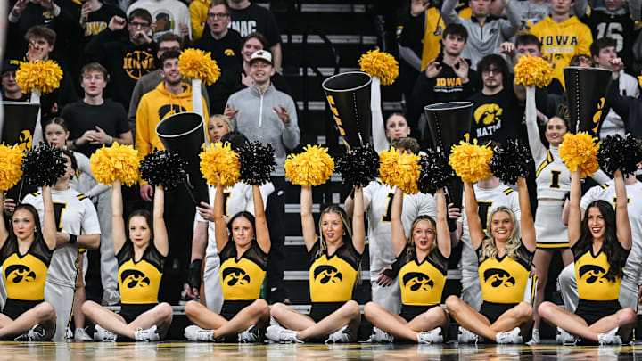 Feb 4, 2025; Iowa City, Iowa, USA; The Iowa Hawkeyes cheerleaders lead the crowd during the second half against the Purdue Boilermakers at Carver-Hawkeye Arena. Mandatory Credit: Jeffrey Becker-Imagn Images
