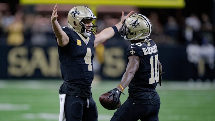 Nov 10, 2024; New Orleans, Louisiana, USA; New Orleans Saints wide receiver Marquez Valdes-Scantling (10) celebrates a touchdown with New Orleans Saints quarterback Derek Carr (4) against the Atlanta Falcons during the first half at Caesars Superdome. Mandatory Credit: Matthew Hinton-Imagn Images
