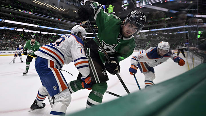May 29, 2025; Dallas, Texas, USA; Edmonton Oilers center Mattias Janmark (13) checks Dallas Stars defenseman Lian Bichsel (6) during the second period in game five of the Western Conference Final of the 2025 Stanley Cup Playoffs at American Airlines Center. Mandatory Credit: Jerome Miron-Imagn Images