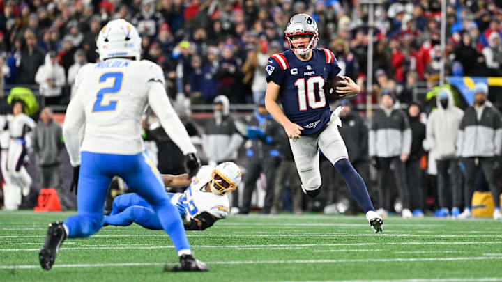 Jan 11, 2026; Foxborough, MA, USA; New England Patriots quarterback Drake Maye (10) rushes during the second quarter against the Los Angeles Chargers in an AFC Wild Card Round game at Gillette Stadium. Mandatory Credit: Eric Canha-Imagn Images