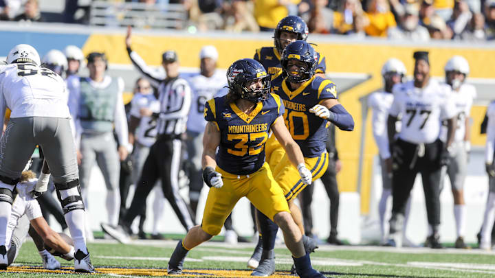 Nov 8, 2025; Morgantown, West Virginia, USA; West Virginia Mountaineers linebacker Ben Bogle (32) celebrates after a sack during the first quarter against the Colorado Buffaloes at Milan Puskar Stadium. Mandatory Credit: Ben Queen-Imagn Images Nov 8, 2025; Morgantown, West Virginia, USA; West Virginia Mountaineers linebacker Ben Bogle (32) celebrates after a sack during the first quarter against the Colorado Buffaloes at Milan Puskar Stadium. Mandatory Credit: Ben Queen-Imagn Images