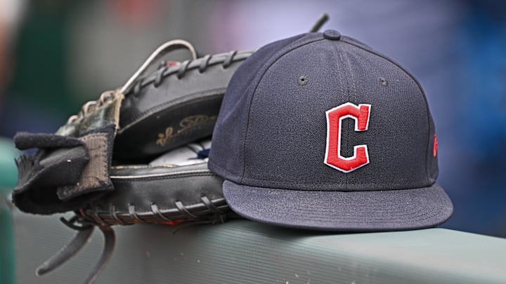 Jun 27, 2024; Kansas City, Missouri, USA; A general view a Cleveland Guardians hat and glove on the dugout railing before a game against the Kansas City Royals at Kauffman Stadium. Mandatory Credit: Peter Aiken-Imagn Images Jun 27, 2024; Kansas City, Missouri, USA; A general view a Cleveland Guardians hat and glove on the dugout railing before a game against the Kansas City Royals at Kauffman Stadium. Mandatory Credit: Peter Aiken-Imagn Images