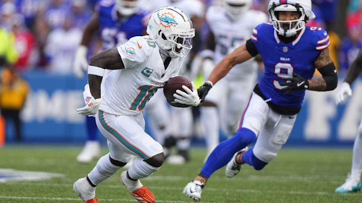 Miami Dolphins wide receiver Tyreek Hill (10) runs with the ball after making a catch against the Buffalo Bills during the second half at Highmark Stadium.