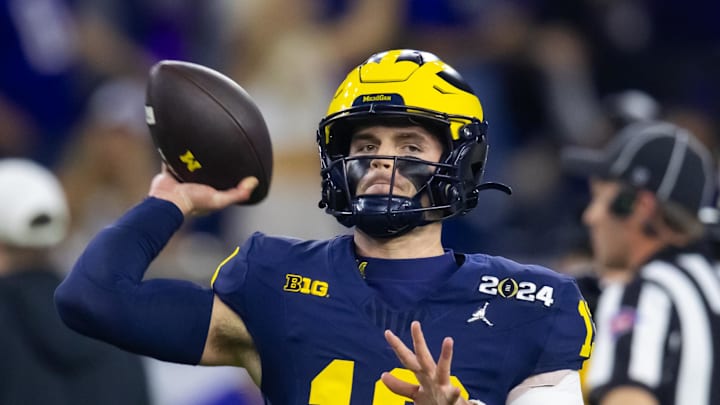 Jan 8, 2024; Houston, TX, USA; Michigan Wolverines quarterback Jack Tuttle (13) against the Washington Huskies during the 2024 College Football Playoff national championship game at NRG Stadium. Mandatory Credit: Mark J. Rebilas-Imagn Images