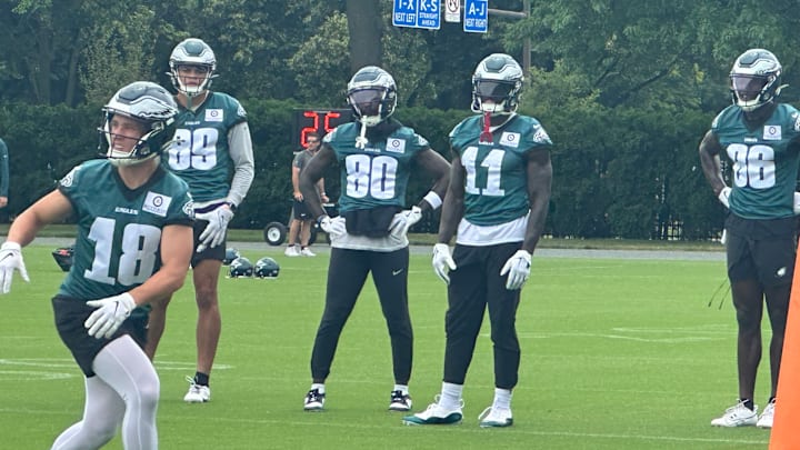 Britain Covey gets ready to make a catch as Philadelphia Eagles teammates, from left to right, Johnny Wilson, Parris Campbell, A.J. Brown, and Joseph Ngata, look on during the final day of mandatory minicamp on June 6, 2024. Britain Covey gets ready to make a catch as Philadelphia Eagles teammates, from left to right, Johnny Wilson, Parris Campbell, A.J. Brown, and Joseph Ngata, look on during the final day of mandatory minicamp on June 6, 2024.