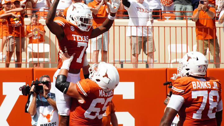 Aug 31, 2024; Austin, Texas, USA; Texas Longhorns wide receiver Isaiah Bond (7) and lineman Jake Majors (65) celebrate after a touchdown against the Colorado State Rams in the first half at Darrell K Royal-Texas Memorial Stadium. Mandatory Credit: Aaron Meullion-Imagn Images