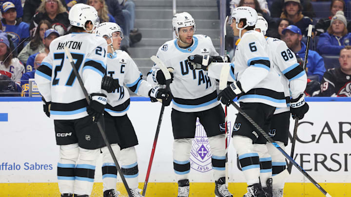 Nov 4, 2025; Buffalo, New York, USA;  Utah Mammoth center Nick Schmaltz (8) celebrates his goal with teammates during the third period against the Buffalo Sabres at KeyBank Center. Mandatory Credit: Timothy T. Ludwig-Imagn Images