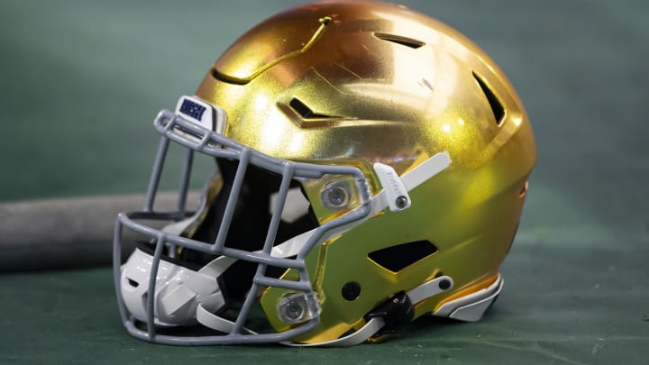 Jan 1, 2022; Glendale, Arizona, USA; Detailed view of a gold Notre Dame Fighting Irish helmet during the 2022 Fiesta Bowl at State Farm Stadium. Jan 1, 2022; Glendale, Arizona, USA; Detailed view of a gold Notre Dame Fighting Irish helmet during the 2022 Fiesta Bowl at State Farm Stadium.