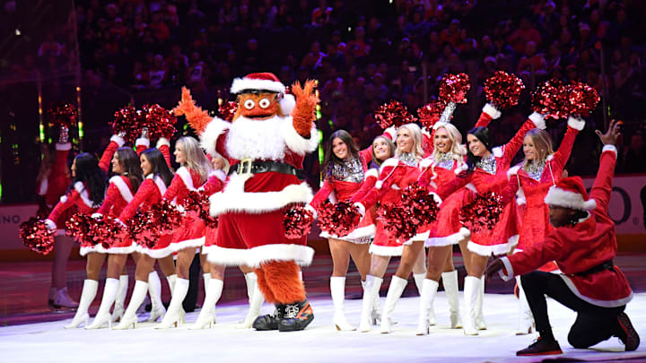 Dec 23, 2019; Philadelphia, Pennsylvania, USA; Philadelphia Flyers mascot Gritty and the Ice Girls