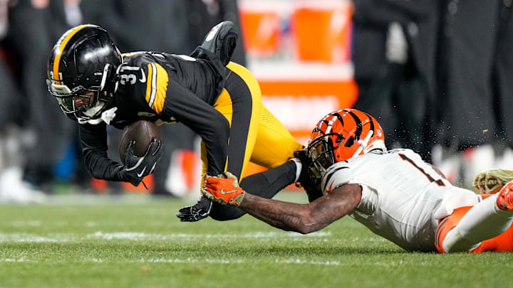 Pittsburgh Steelers cornerback Beanie Bishop Jr. (31) intercepts a pass stripped from Cincinnati Bengals wide receiver Ja'Marr Chase (1) in the second quarter of the NFL Week 18 game between the Pittsburgh Steelers and the Cincinnati Bengals at Acrisure Stadium in Pittsburgh on Saturday, Jan. 4, 2025.