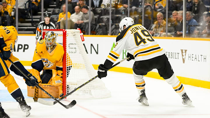 Oct 22, 2024; Nashville, Tennessee, USA;  Nashville Predators goaltender Juuse Saros (74) and defenseman Roman Josi (59) blocks the shot of Boston Bruins left wing Max Jones (49) during the second period at Bridgestone Arena. Mandatory Credit: Steve Roberts-Imagn Images