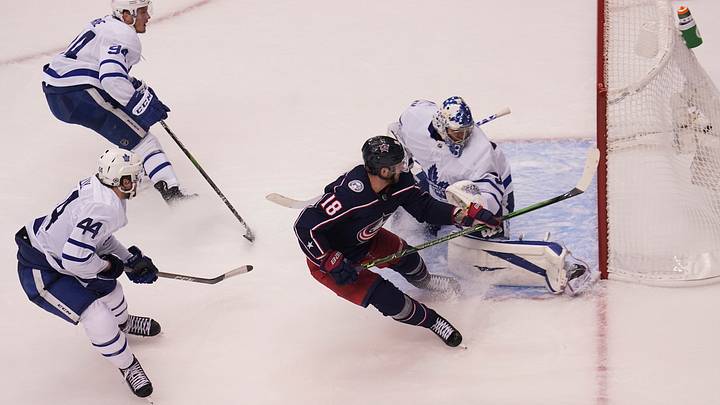 Aug 6, 2020; Toronto, Ontario, CAN; Columbus Blue Jackets forward Pierre-Luc Dubois (18) scores the winning goal against Toronto Maple Leafs goaltender Frederik Andersen (31) as defenseman Tyson Barrie (94) and defenseman Morgan Rielly (44) look on during overtime of Eastern Conference qualifications at Scotiabank Arena. Mandatory Credit: John E. Sokolowski-USA TODAY Sports Aug 6, 2020; Toronto, Ontario, CAN; Columbus Blue Jackets forward Pierre-Luc Dubois (18) scores the winning goal against Toronto Maple Leafs goaltender Frederik Andersen (31) as defenseman Tyson Barrie (94) and defenseman Morgan Rielly (44) look on during overtime of Eastern Conference qualifications at Scotiabank Arena. Mandatory Credit: John E. Sokolowski-USA TODAY Sports