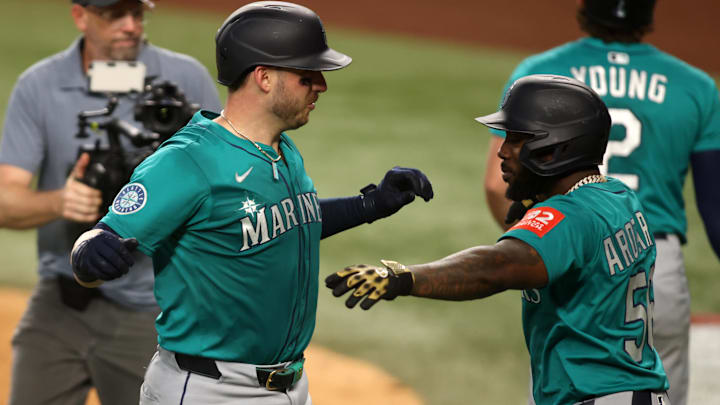 Seattle Mariners catcher Mitch Garver (left) and outfielder Randy Arozarena celebrate after the former's home run against the Texas Rangers on June 29 at Globe Life Field.